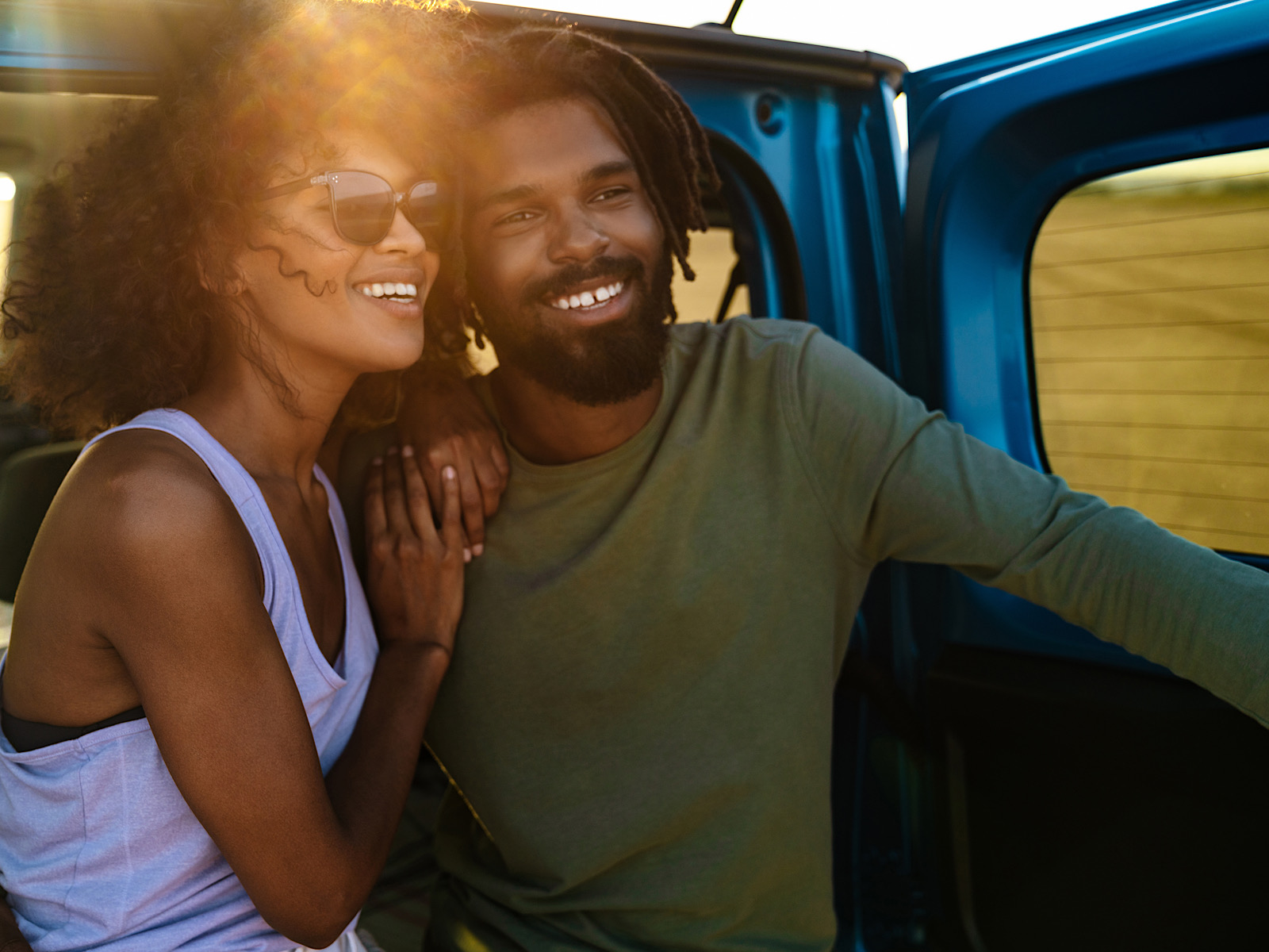 Smiling happy african young couple by vadymvdrobot