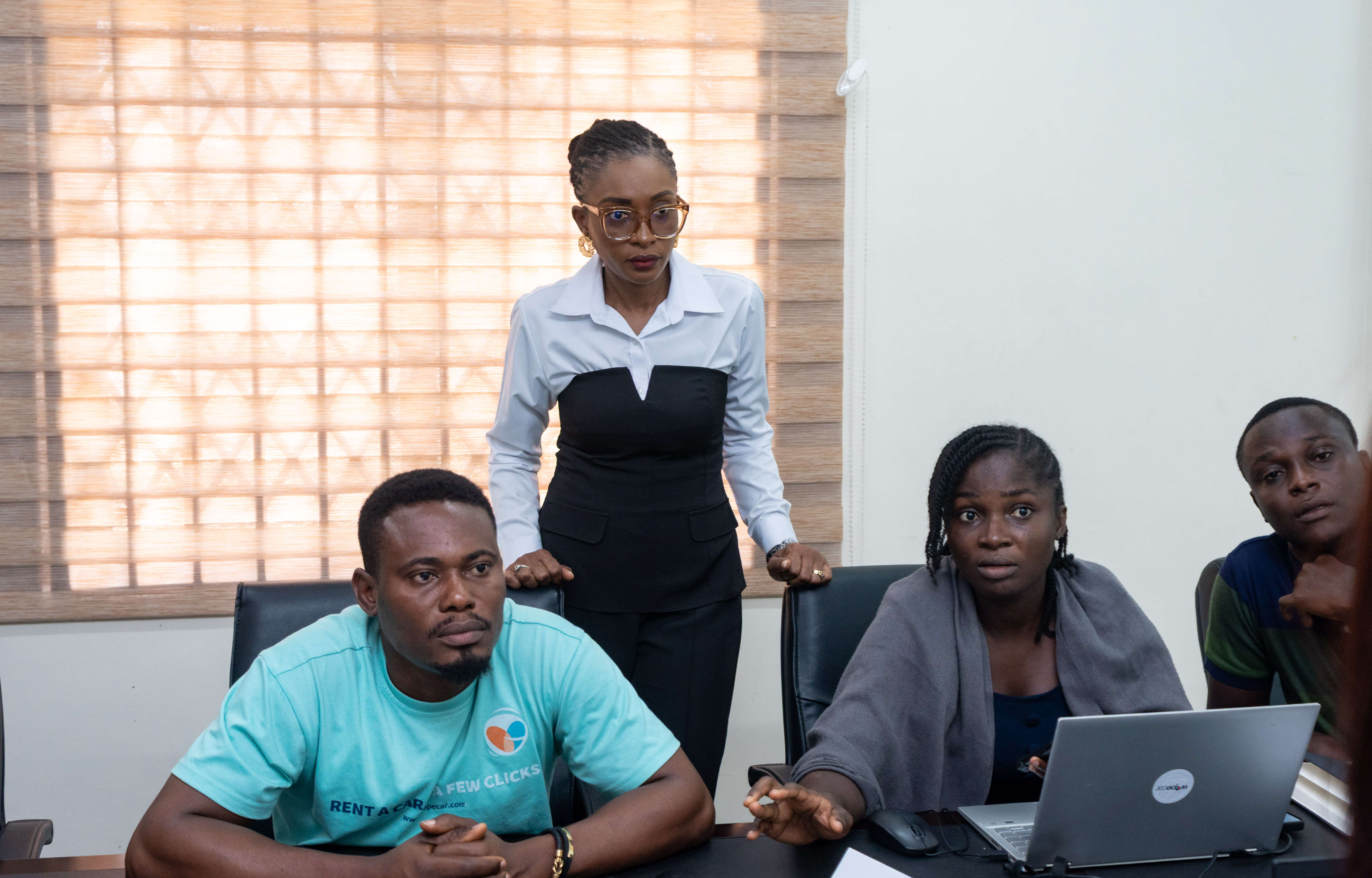 Image of Amanda Akushie with staff of WopeCar; customer experience training