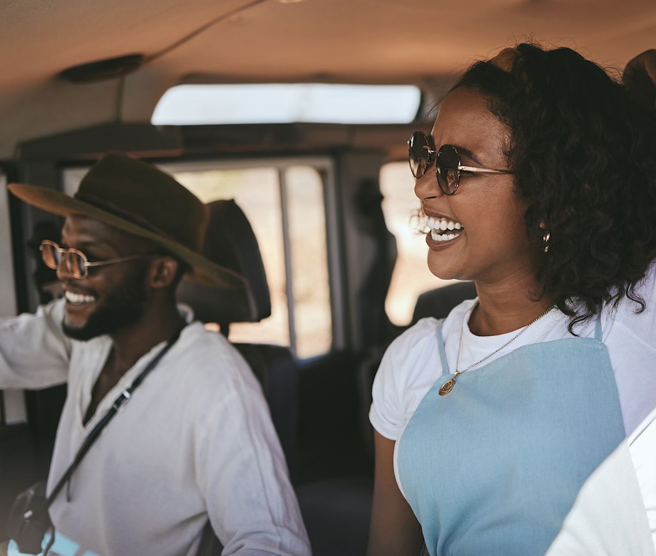 Road trip, driving and black couple drive to travel on a summer vacation with a smile. Happy girlfr by YuriArcursPeopleimages