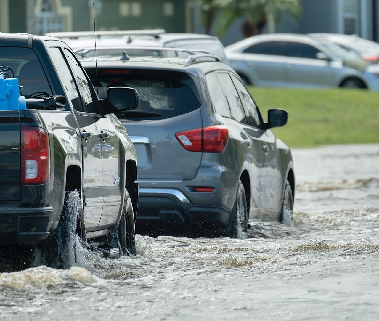 Hurricahe rainfall flooded Florida road with evacuating cars by bilanol